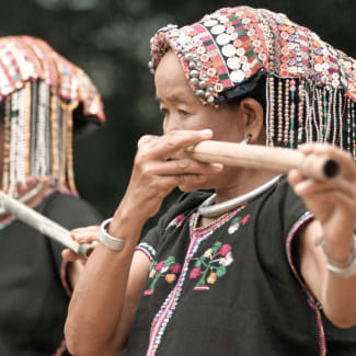 Woman playing traditional instrument