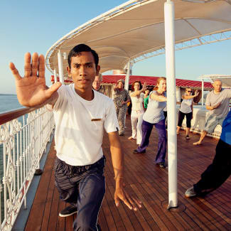 People taking Tai Chi class on the sun deck