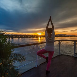 A person doing yoga on the deck